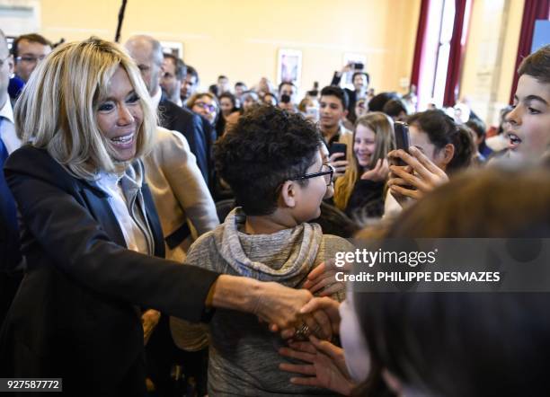 The French President's wife, Brigitte Macron meets with high school students during a visit with the French Education Minister to promote the fight...