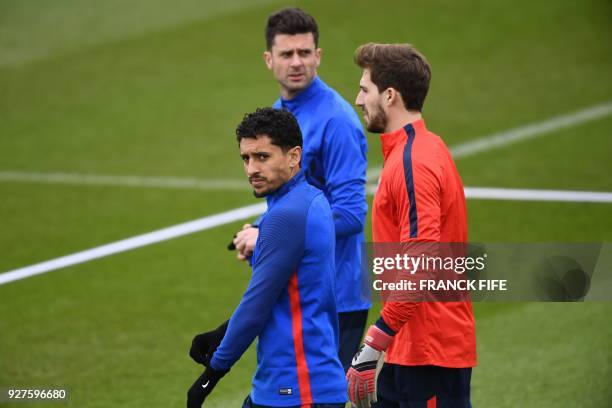 Paris Saint-Germain's Brazilian defender Marquinhos, Paris Saint-Germain's Italian midfielder Thiago Motta and Paris Saint-Germain's German...