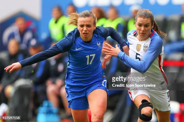 United States of America defender Kelley O'Hara battles France defender Marion Torrent during the first half the SheBelieves Cup Womens Soccer game...