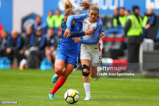 United States of America defender Kelley O'Hara battles France defender Marion Torrent during the first half the SheBelieves Cup Womens Soccer game...