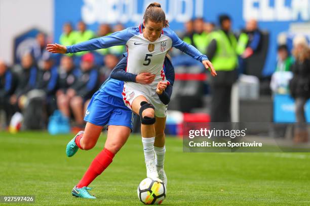 United States of America defender Kelley O'Hara battles France defender Marion Torrent during the first half the SheBelieves Cup Womens Soccer game...