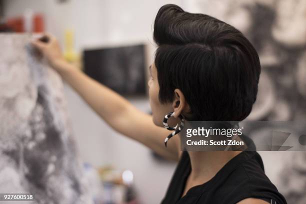 artist painting in her studio - scott zdon stock pictures, royalty-free photos & images