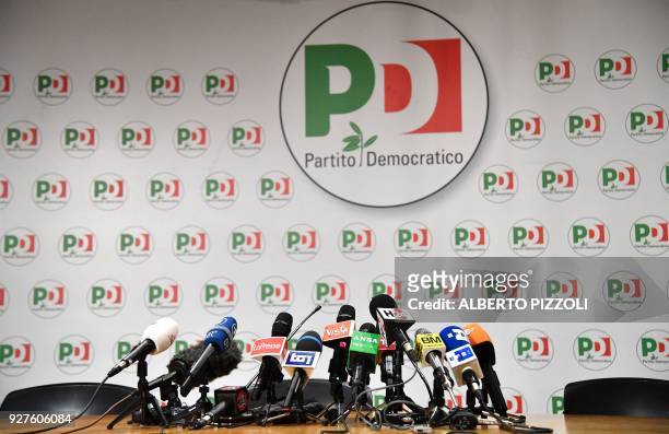 Microphones are set on a table before a press conference of former Prime Minister and leader of the Democratic Party , Matteo Renzi, a day after...