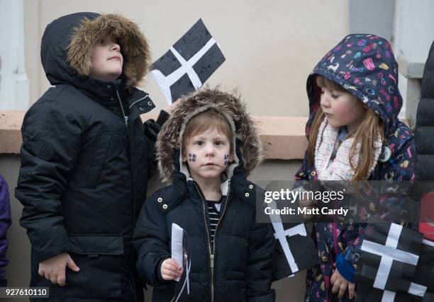 Cornish flags are waved by school children attending the St Piran's Day march, which celebrates St Piran, patron saint of tinners and regarded by...