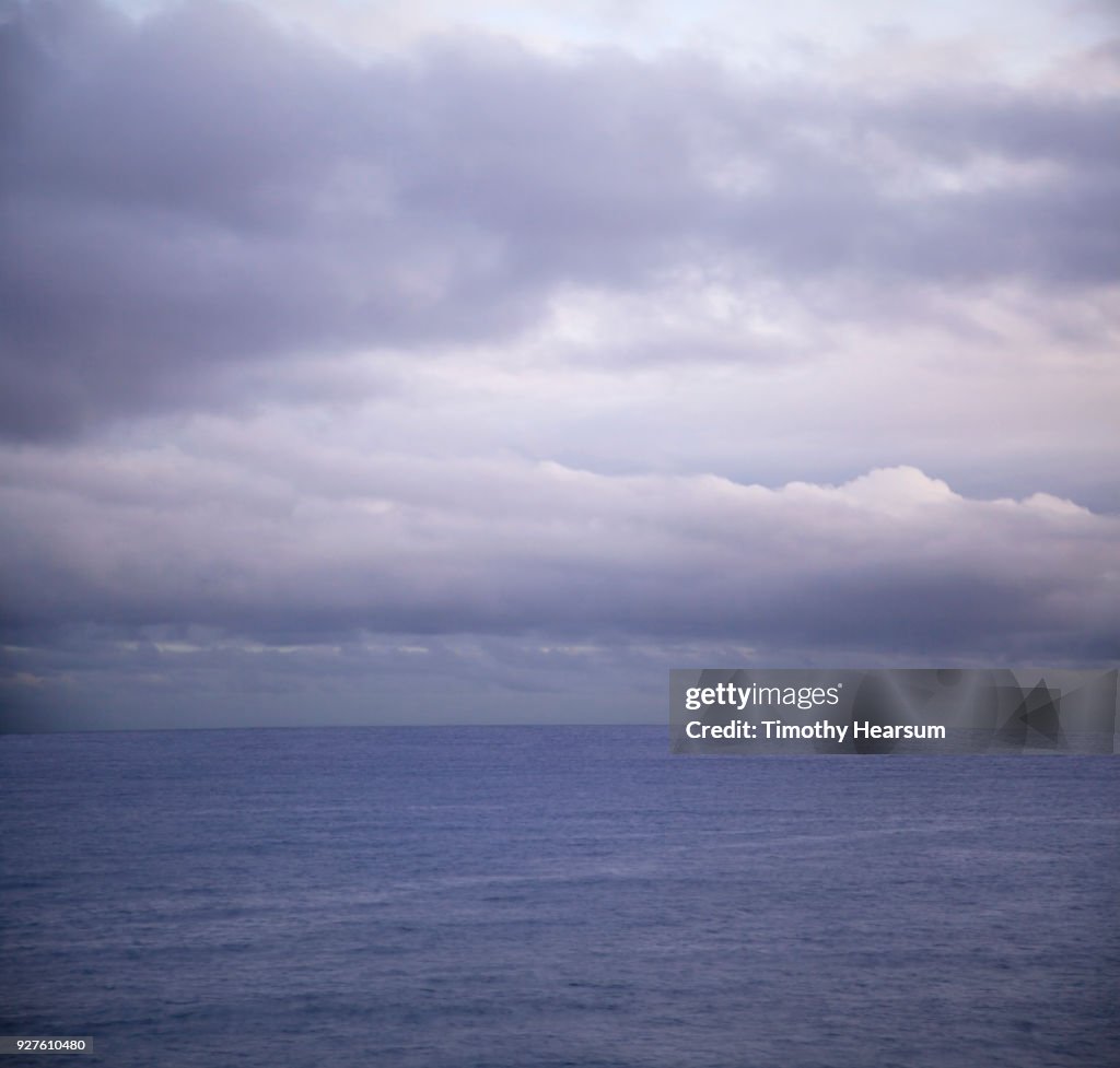 Ultraviolet sky and clouds creating a matching colored ocean