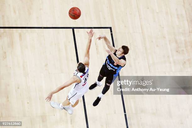 Tom Abercrombie of the Breakers takes a three pointer against Chris Goulding of United during game two of the NBL semi final series between Melbourne...