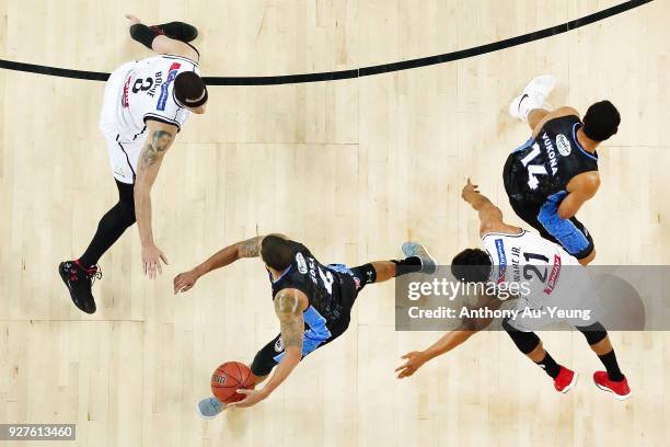 Edgar Sosa of the Breakers runs off a screen set by teammate Mika Vukona as Casper Ware of United tries to fight through during game two of the NBL...