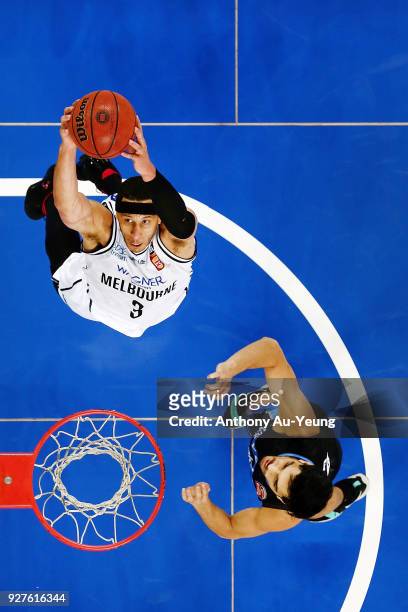 Josh Boone of United goes up against Shea Ili of the Breakers during game two of the NBL semi final series between Melbourne United and the New...