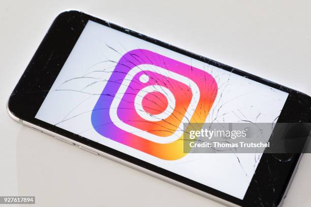 Berlin, Germany The logo of instagram is displayed on a smartphone with splintered glass on March 05, 2018 in Berlin, Germany.