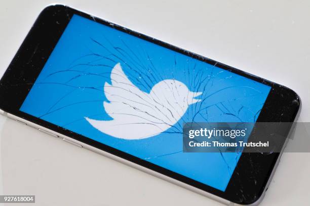 Berlin, Germany The logo of Twitter is displayed on a smartphone with splintered glass on March 05, 2018 in Berlin, Germany.