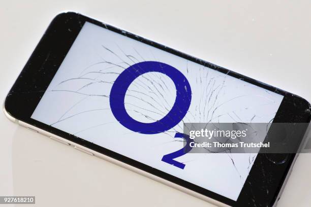 Berlin, Germany The logo of O2 is displayed on a smartphone with splintered glass on March 05, 2018 in Berlin, Germany.