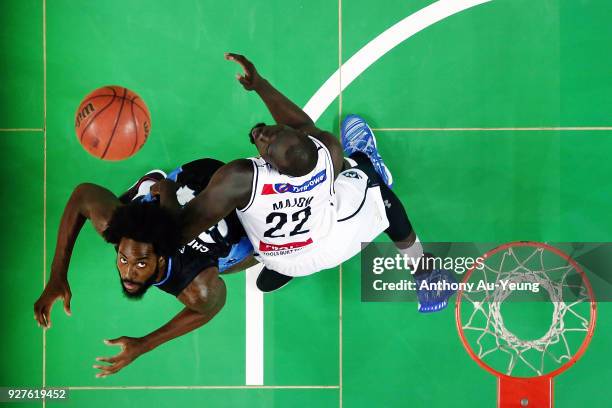 Rakeem Christmas of the Breakers competes for a rebound against Majok Majok of United during game two of the NBL semi final series between Melbourne...