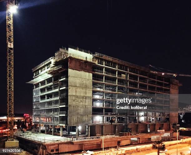 construction site at night - work sites night stock pictures, royalty-free photos & images