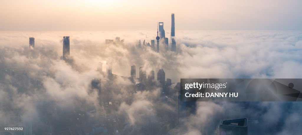 Panoramic view of Shanghai city over the advection fog at sunrise