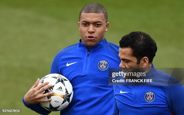 Paris Saint-Germain's French forward Kylian MBappe reacts during a training session at Saint-Germain-en-Laye, western Paris on March 4 on the eve of...