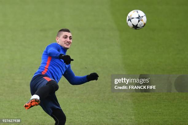 Paris Saint-Germain's Italian midfielder Marco Verratti kicks the ball during a training session on March 5, 2018 at the Ooredoo training center in...