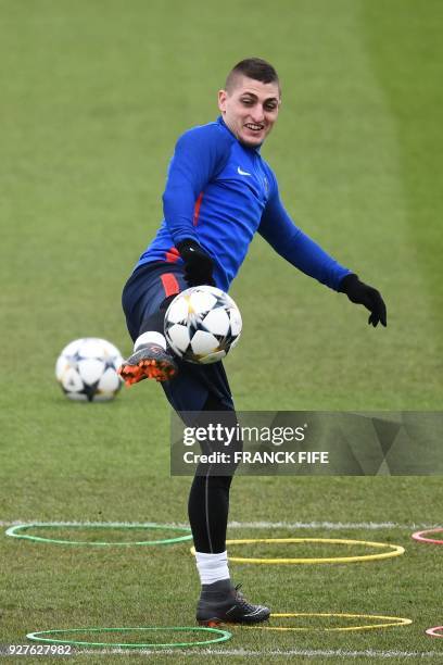 Paris Saint-Germain's Italian midfielder Marco Verratti kicks the ball during a training session on March 5, 2018 at the Ooredoo training center in...