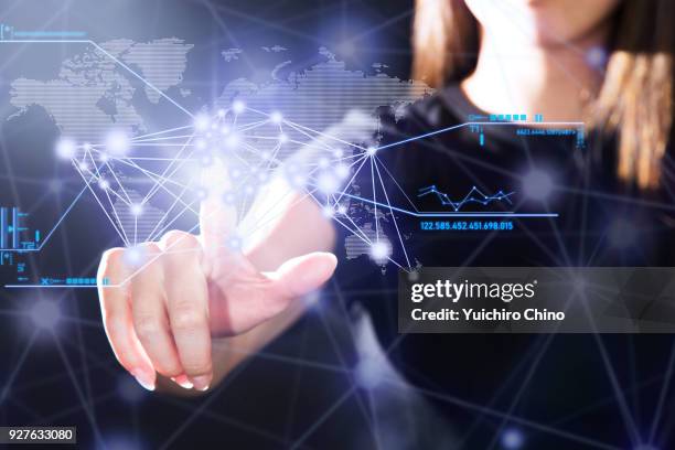 woman operating the digital interface technology - touch screen map stock pictures, royalty-free photos & images