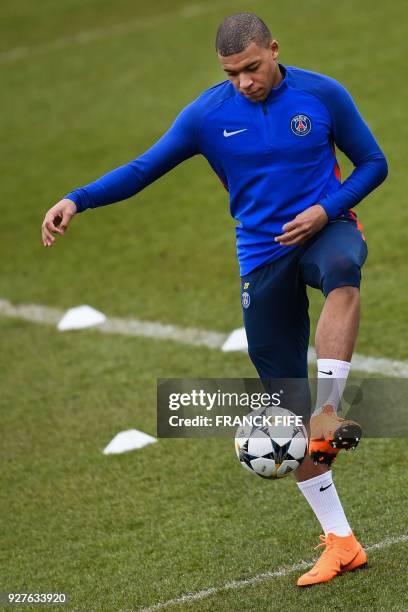 Paris Saint-Germain's French forward Kylian Mbappé attends a training session on March 5, 2018 at the Ooredoo training center in...