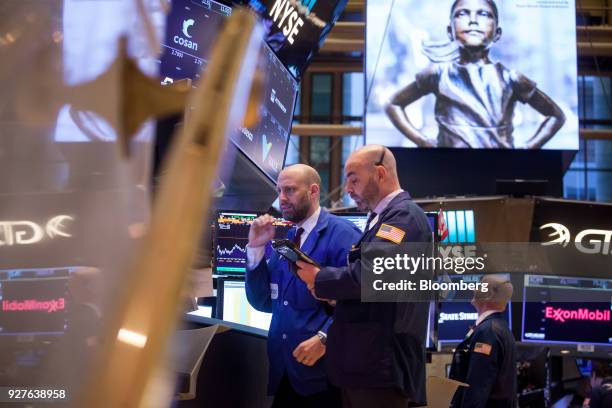 Traders work on the floor of the New York Stock Exchange in New York, U.S., on Monday, March 5, 2018. U.S. Stocks turned higher and Treasuries erased...