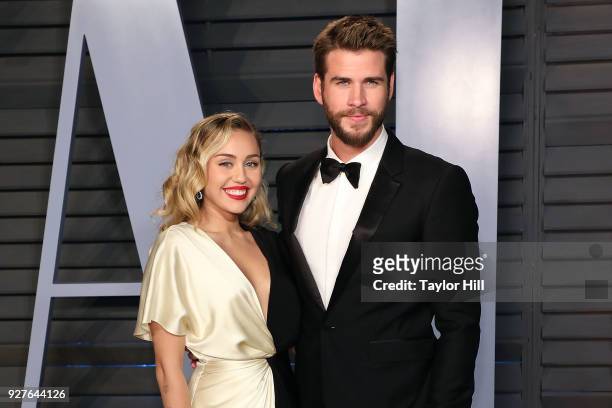 Miley Cyrus and Liam Hemsworth attend the 2018 Vanity Fair Oscar Party hosted by Radhika Jones at the Wallis Annenberg Center for the Performing Arts...