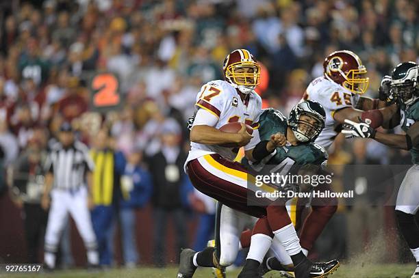 Quarterback Jason Campbell of the Washington Redskins gets sacked by defensive end Jason Babin of the Philadelphia Eagles on October 26, 2009 at...