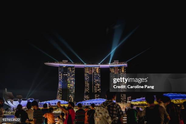 marina bay sands' laser light show. - caroline pang bildbanksfoton och bilder