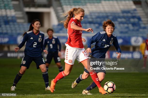 Frederikke Thogersen of Denmark competes for the ball with Mizuho Sakaguchi of Japan during the Women's Algarve Cup Tournament match between Denmark...