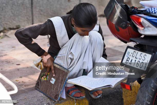 Students of Class X and XII are seen doing their last minute revision, outside their examination centre, at Kendra Vidyala Gole Market, on March 5,...