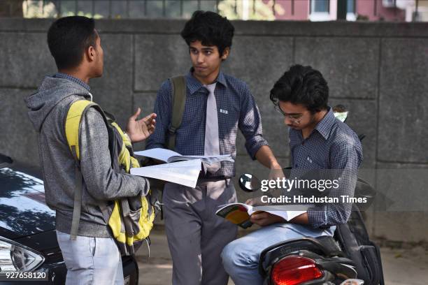 Students of Class X and XII are seen doing their last minute revision, outside their examination centre, at Kendra Vidyala Gole Market, on March 5,...