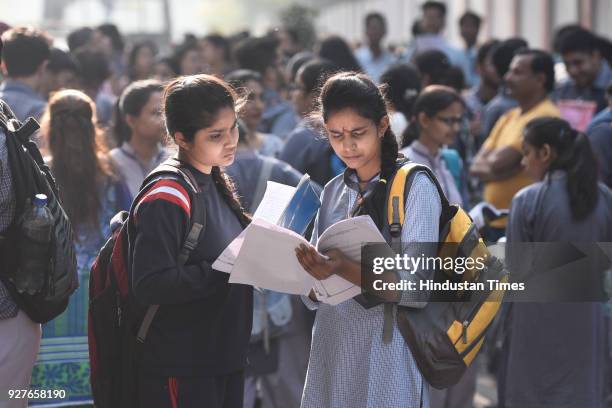 Students of Class X and XII are seen doing their last minute revision, outside their examination centre, at Kendra Vidyala Gole Market, on March 5,...