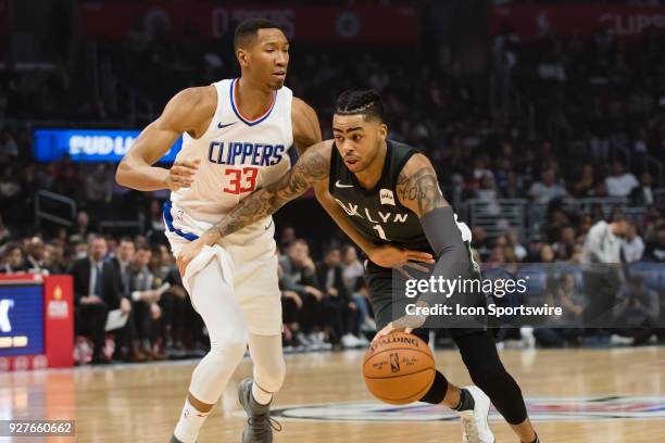 Brooklyn Nets Guard D'Angelo Russell drives the ball up the middle against Los Angeles Clippers Forward Wesley Johnson during the game between the...