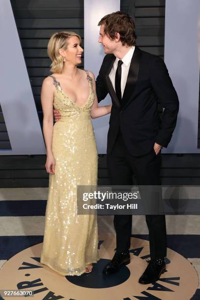 Emma Roberts and Evan Peters attend the 2018 Vanity Fair Oscar Party hosted by Radhika Jones at the Wallis Annenberg Center for the Performing Arts...