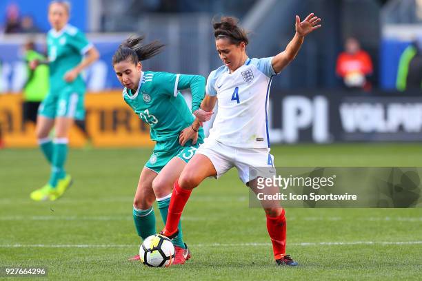 Germany forward Hasret Kayikci battles England midfielder Fara Williams during the first half of the SheBelieves Cup Womens Soccer game between...