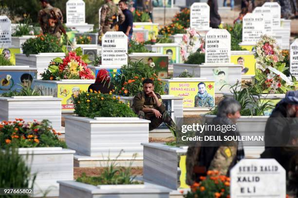 Members of the Kurdish People's Protection Units attend the funeral of Kurdish fighters from the Syrian Democratic Forces that were killed in combat...