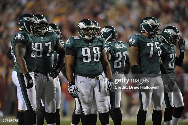 Defensive tackle Mike Patterson and teammates of the Philadelphia Eagles wait for a play during the game against the Washington Redskins on October...