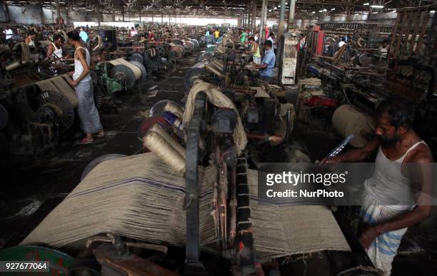 Workers busy in making jute sacks at Latif Bawany Jute Mills in Demra, Dhaka, on 5 March 2018 amid the country is ready to celebrate National Jute...