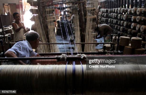 Workers busy in making jute sacks at Latif Bawany Jute Mills in Demra, Dhaka, on 5 March 2018 amid the country is ready to celebrate National Jute...