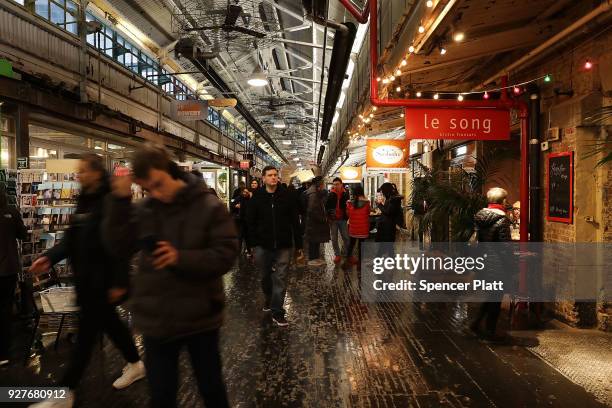 People walk through the Chelsea Market building on March 5, 2018 in New York City. Published reports say that tech giant Google is close to a...