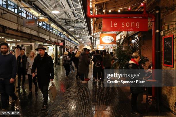 People walk through the Chelsea Market building on March 5, 2018 in New York City. Published reports say that tech giant Google is close to a...