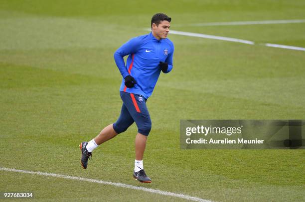 Thiago Silva warms up during a Paris Saint-Germain training session ahead of the Champion's League match against Real Madrid at Centre Ooredoo on...