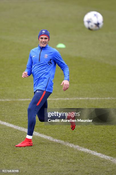 Edinson Cavani warms up during a Paris Saint-Germain training session ahead of the Champion's League match against Real Madrid at Centre Ooredoo on...