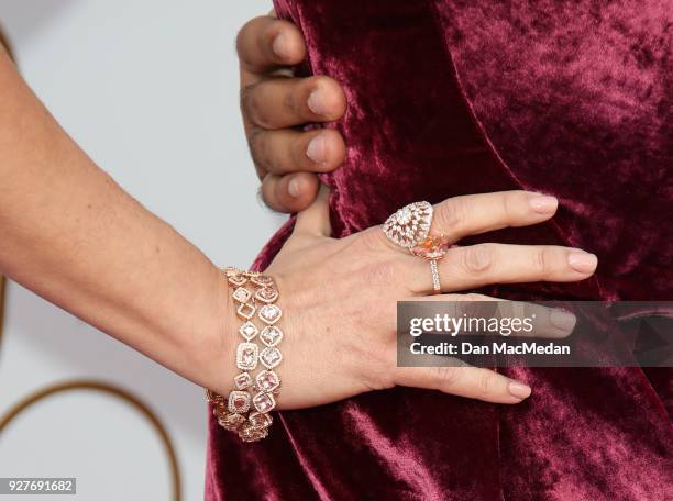 Chelsea Peretti, jewelry detail, attends the 90th Annual Academy Awards at Hollywood & Highland Center on March 4, 2018 in Hollywood, California.