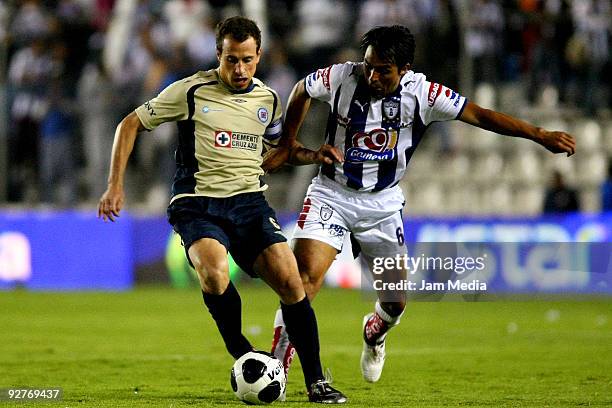 Jaime Correa of Pachuca vies for the ball with Gerardo Torrado of Cruz Azul during their Mexican league Apertura 2009 soccer match at the Hidalgo...