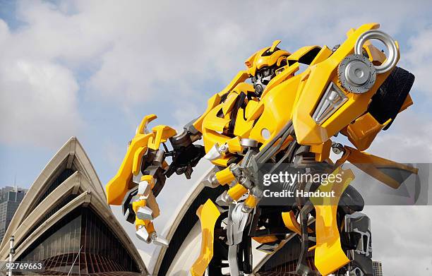 Transformers robot Bumblebee, which stands at 5 metres tall and weighs 3 tonnes, tours Sydney Harbour by barge to launch the DVD of "Transformers:...