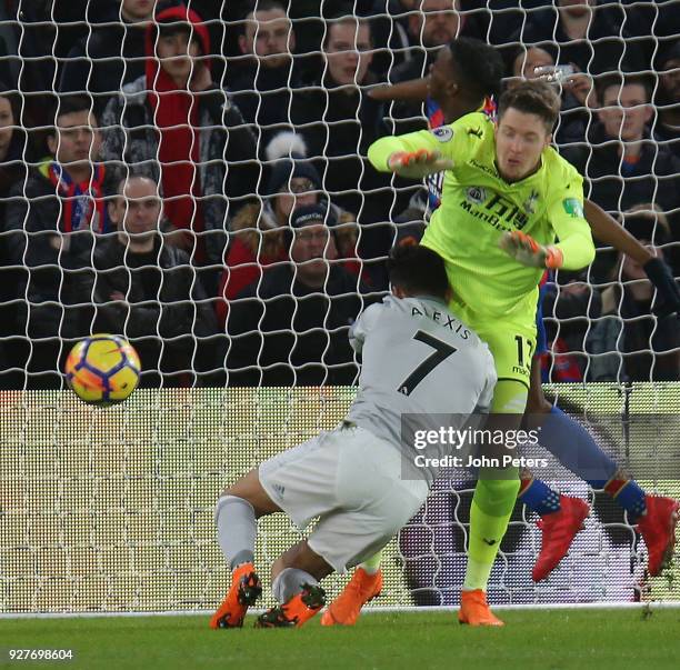 Alexis Sanchez of Manchester United in action with Wayne Hennessey of Crystal Palace during the Premier League match between Crystal Palace and...