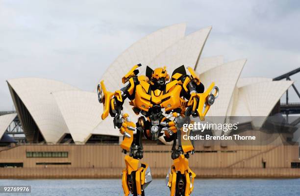 Transformers robot Bumblebee, which stands at 5 metres tall and weighs 3 tonnes, tours Sydney harbour by barge to launch the DVD of "Transformers:...