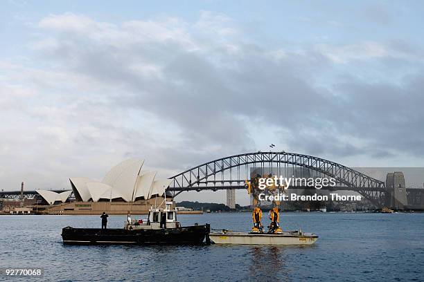 Transformers robot Bumblebee, which stands at 5 metres tall and weighs 3 tonnes, tours Sydney harbour by barge to launch the DVD of "Transformers:...