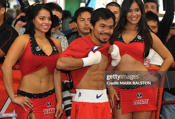 Welterweight boxing champion Manny "PacMan" Pacquiao of the Philippines shows his fitness as he prepares for his fight against Miguel Cotto at the...