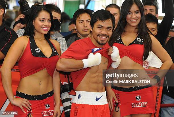 Welterweight boxing champion Manny "PacMan" Pacquiao of the Philippines shows his fitness as he prepares for his fight against Miguel Cotto at the...